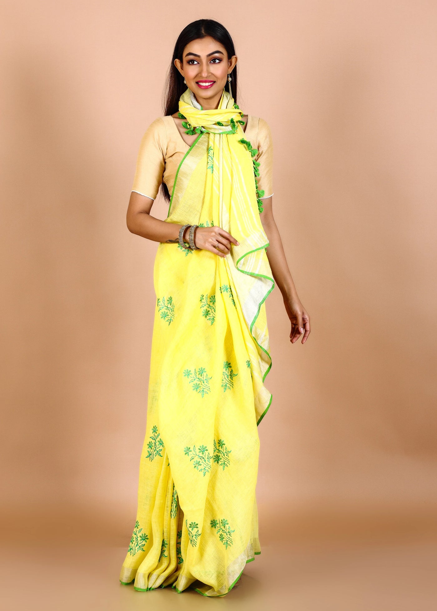 Yellow Pure Linen Floral Embroidery Saree With Jadi Border pompom