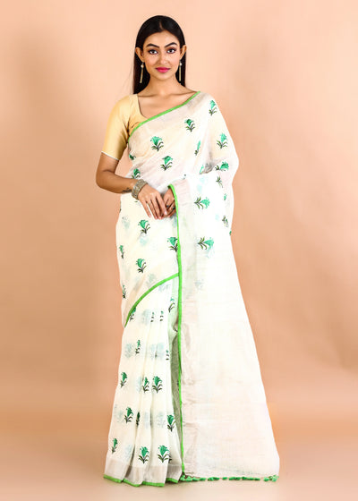 Off White Pure Linen Floral Embroidery Saree With Jadi Border pompom